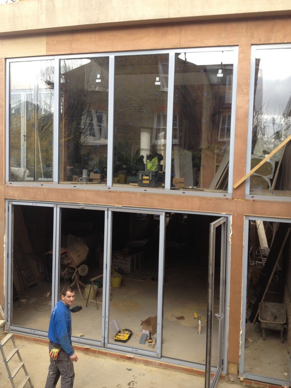 Aluminium bi-fold doors with two-storey glazing in Richmond